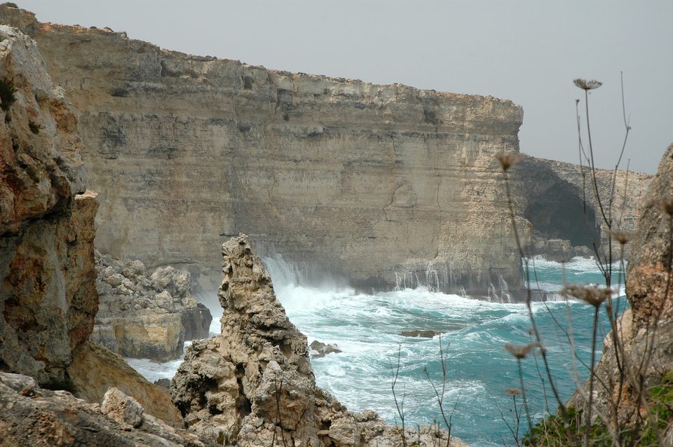 Sea cliffs and a rocky coast with waves breaking below