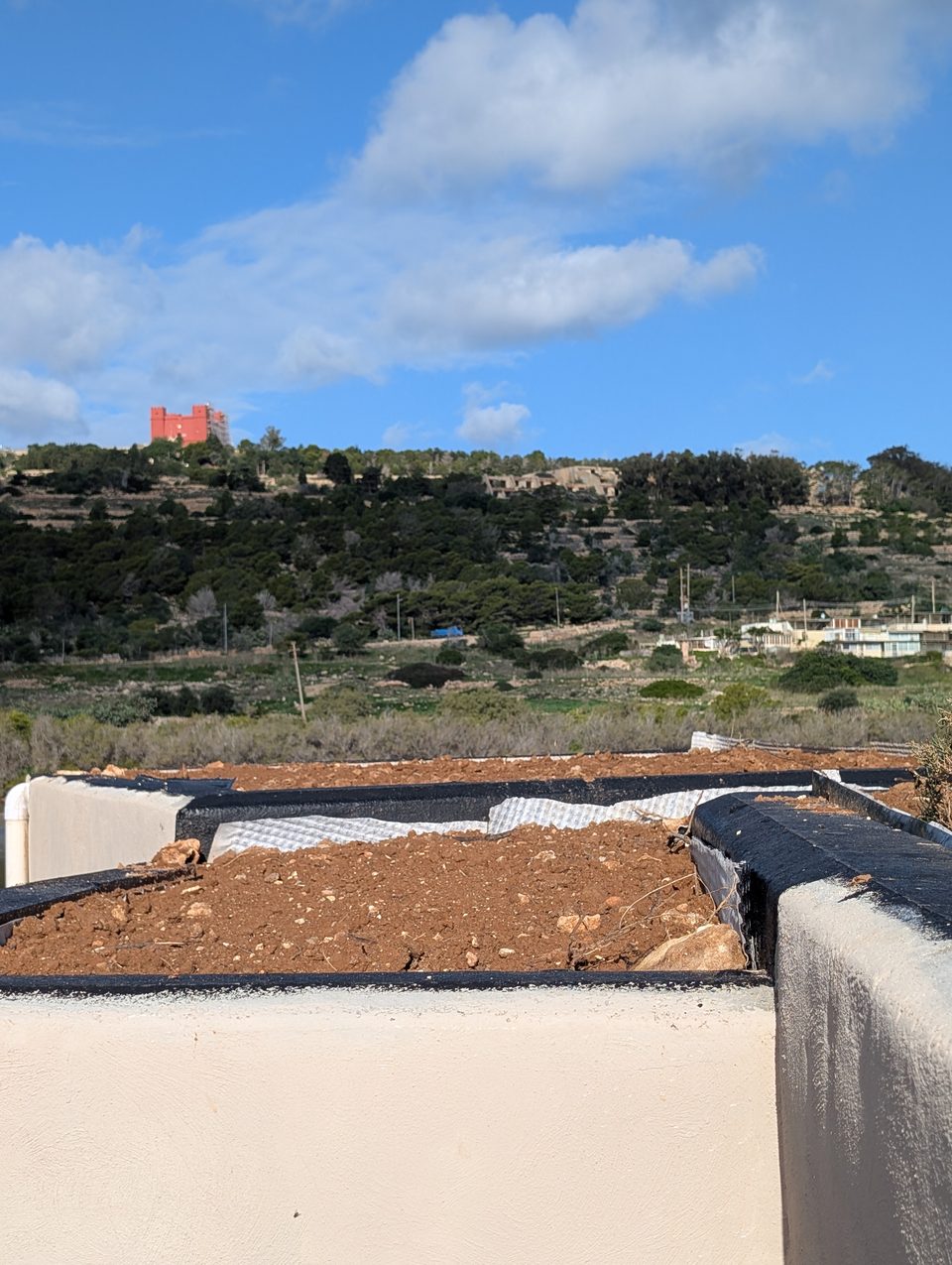 A planting bed on a roof overlooking the countryside
